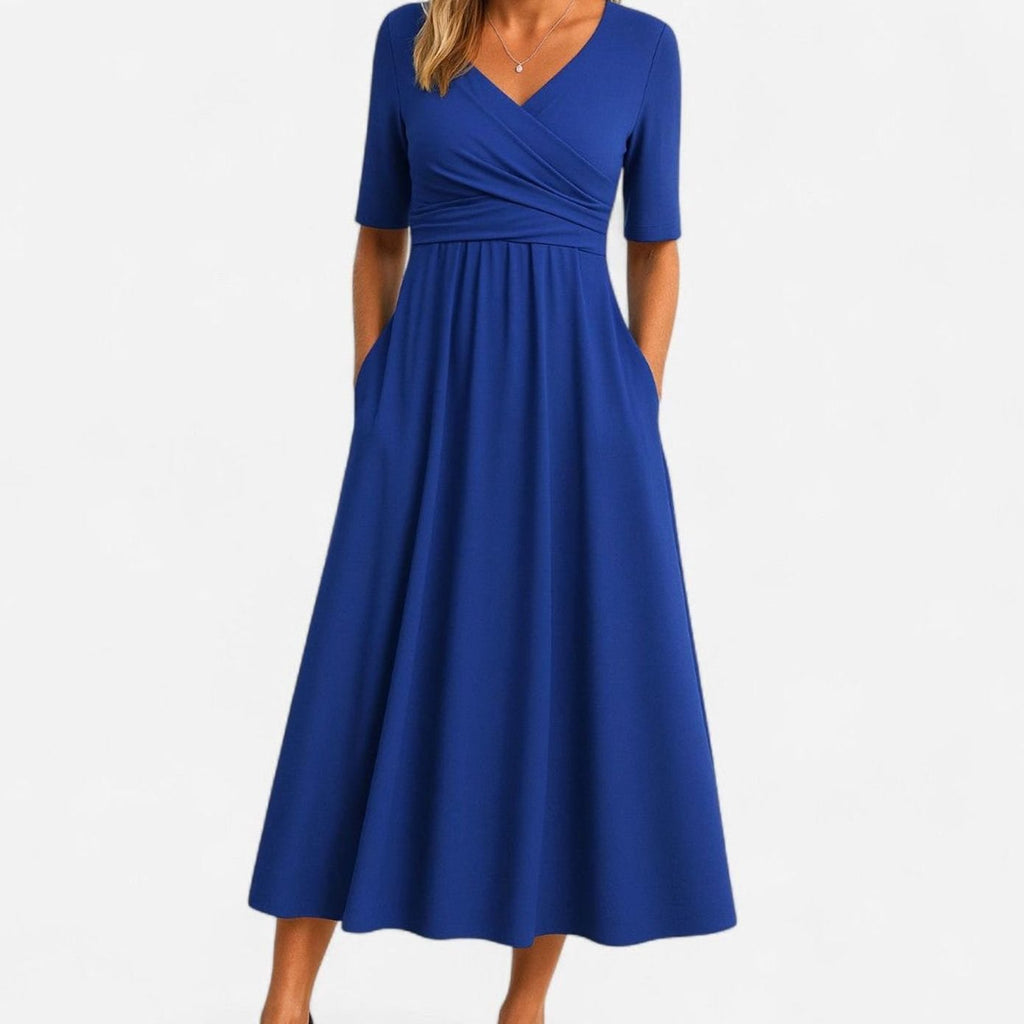 Vestido midi con falda evasé y bolsillos laterales discretos
