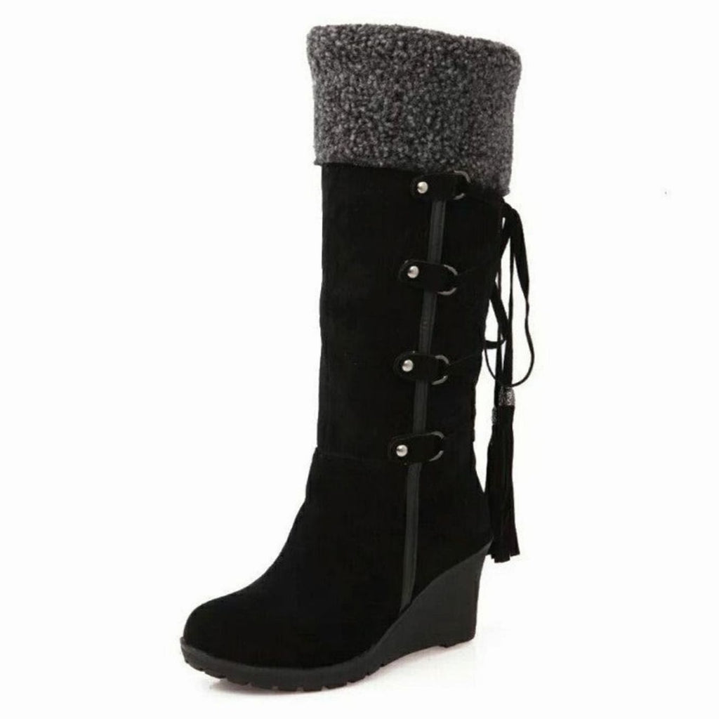 Botas altas hasta la rodilla combinadas con look de invierno para mujer