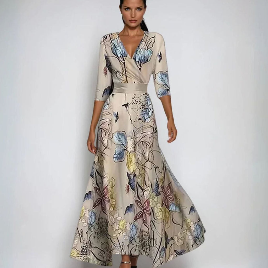 Vestido maxi floral con mangas tres cuartos y cintura entallada
