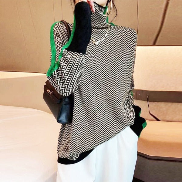 Detalle del tejido jaspeado y la franja de contraste del suéter Nora